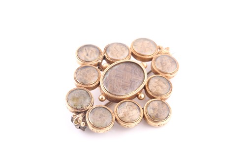 Lot 457 - A mourning brooch The central oval-shaped...