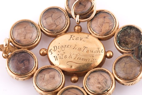 Lot 457 - A mourning brooch The central oval-shaped...