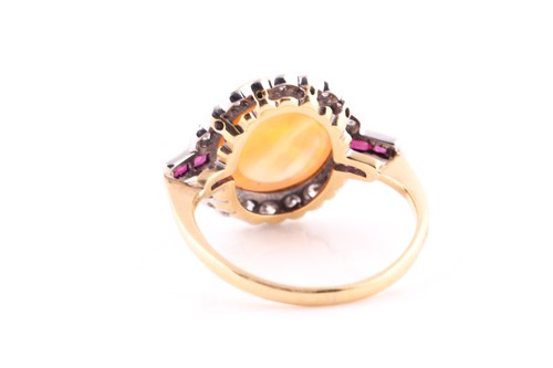 Lot 551 - An Art Deco opal, ruby and diamond ring,of...