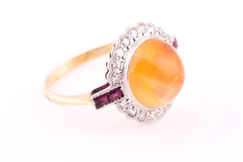 Lot 551 - An Art Deco opal, ruby and diamond ring,of...