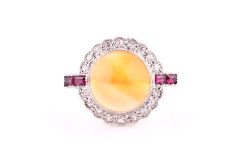 Lot 551 - An Art Deco opal, ruby and diamond ring,of...