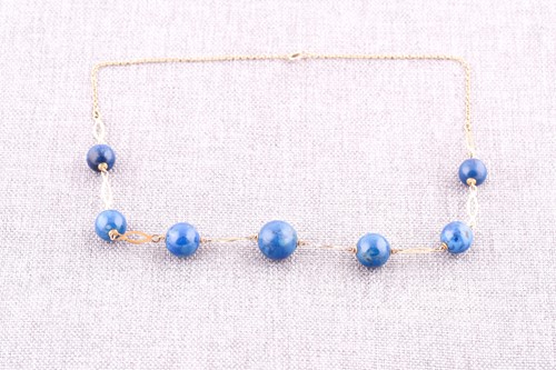 Lot 683 - A lapis lazuli necklace,he trace-link chain...