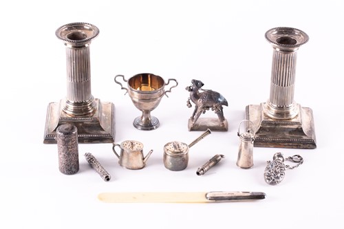 Lot 828 - A pair of Victorian filled silver candlesticks,...