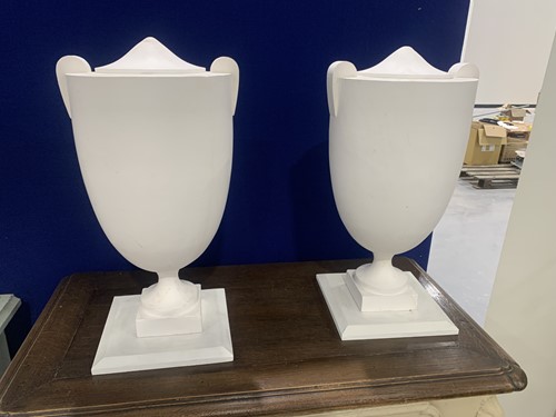 Lot 105 - A set of four white painted composition...