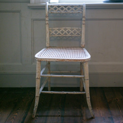 Lot 109 - A Regency painted faux bamboo soiree chair...