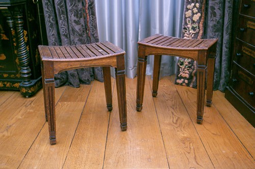 Lot 129 - A pair of safari style wooden stools or side...