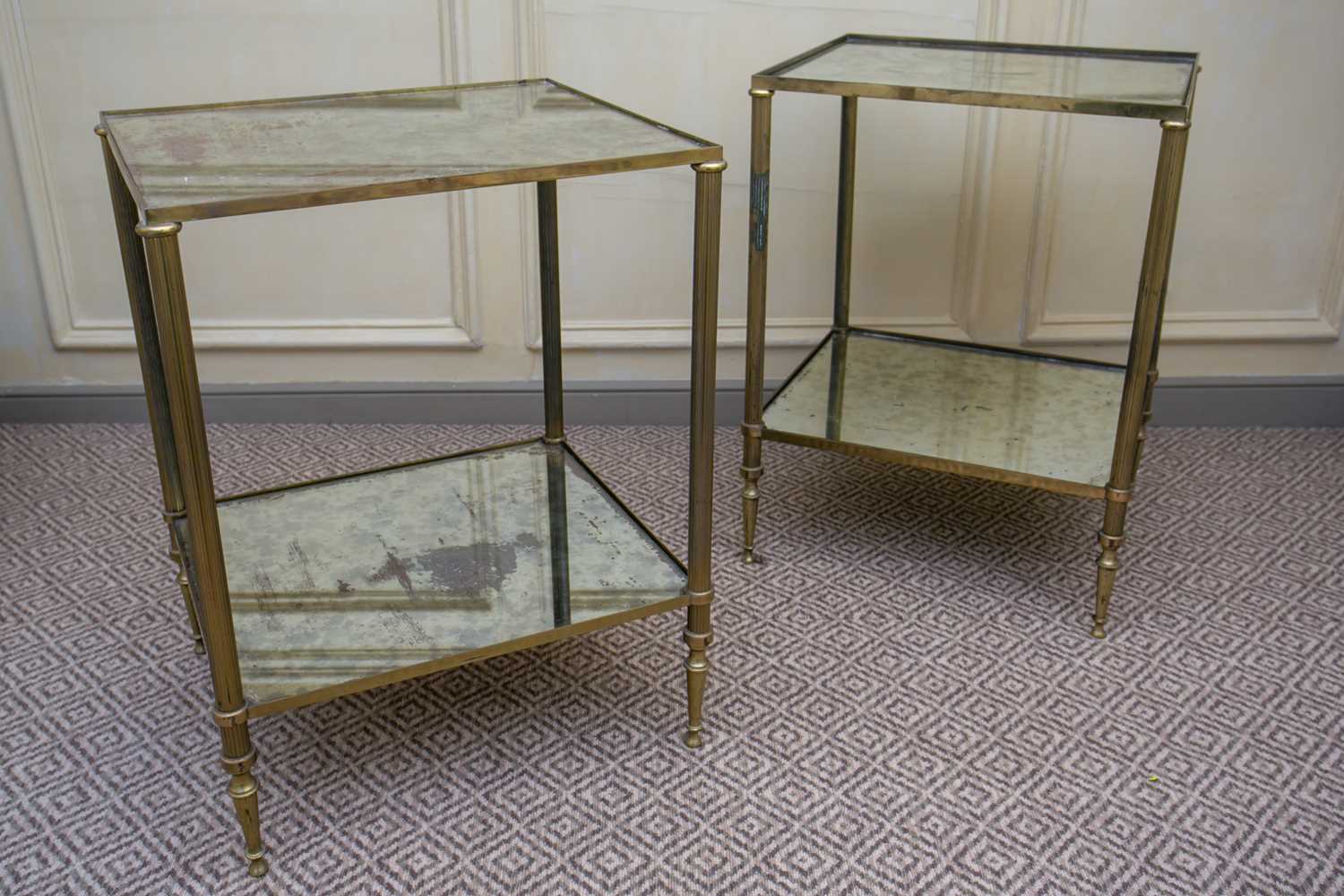 Lot 16 - A pair of gilt brass and distressed mirror...