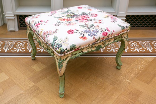 Lot 19 - A green and floral painted George I style foot...