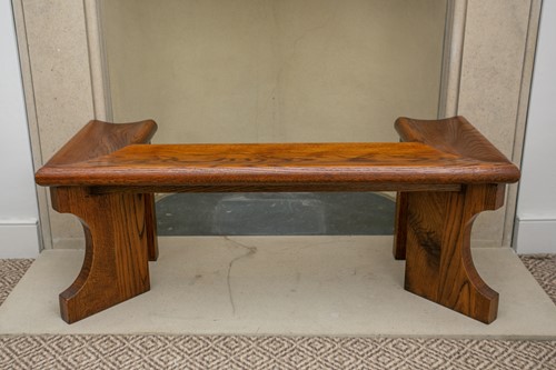 Lot 20 - A 20th century stained oak club fender with...