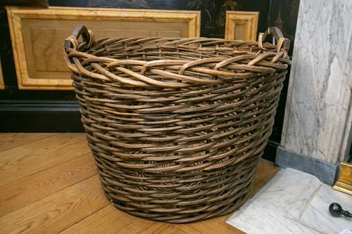 Lot 62 - A large circular two handled woven willow...