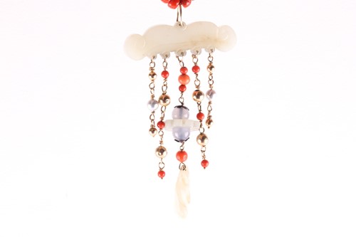 Lot 421 - A coral and jadeite pendant necklace the row...