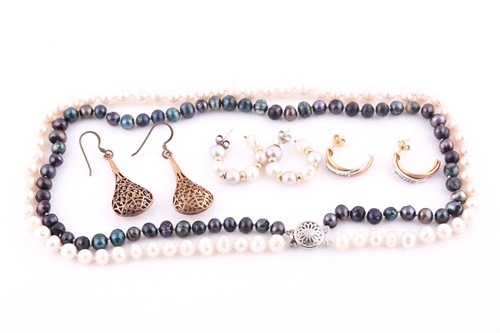 Lot 696 - A double-strand cultured pearl necklace and...