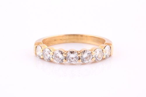 Lot 519 - A diamond seven-stone ring Set to the front...