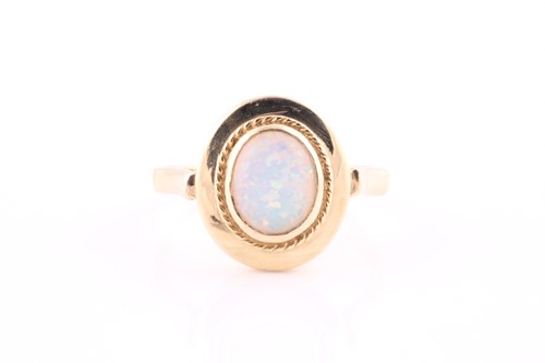 Lot 608 - A synthetic opal single-stone ring The oval...