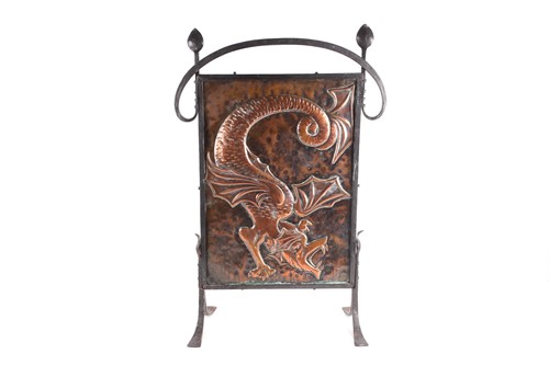 Lot 208 - An Arts & Crafts style fire screen, with a...