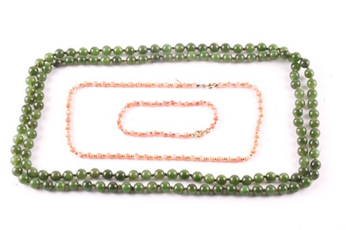 Lot 475 - A jade bead long necklace, beads averaging 8mm...