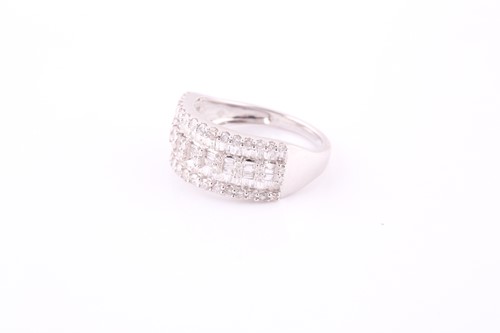 Lot 424 - A diamond dress ring Set to the front with...
