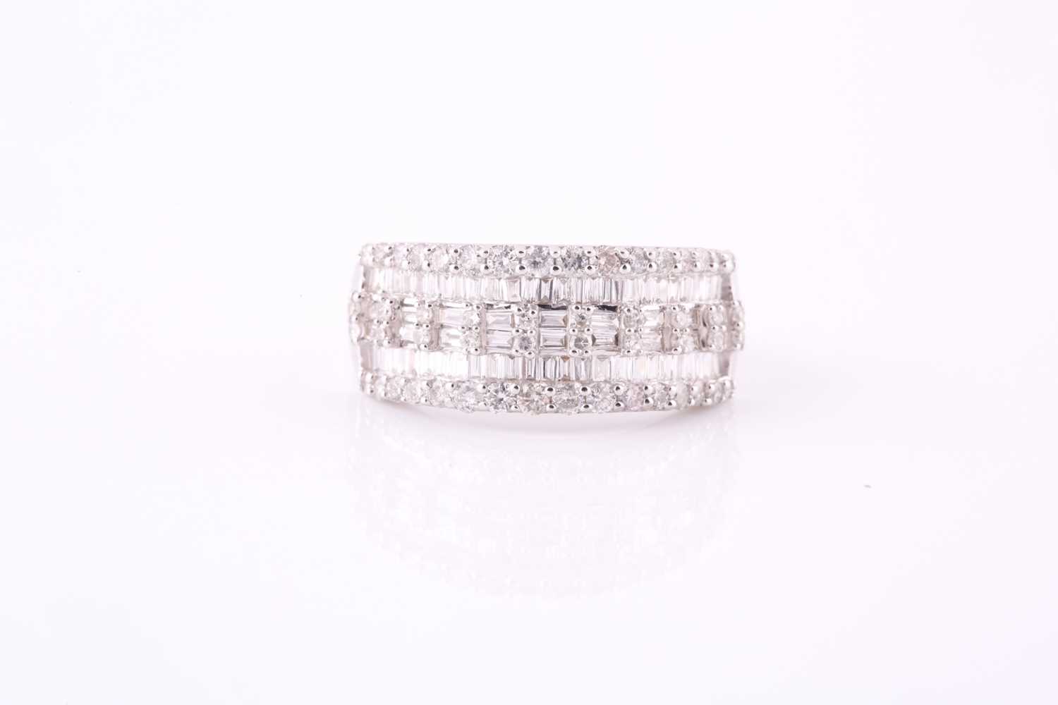 Lot 424 - A diamond dress ring Set to the front with...