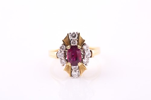 Lot 390 - A ruby and diamond cluster ring, the oval four...