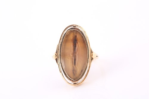 Lot 575 - A swivel ring, the oval pale grey agate stone...