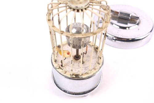 Lot 244 - A mid-20th century automaton clock, a bird in...