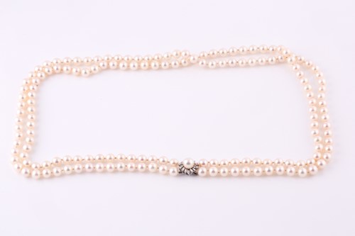 Lot 603 - A two row cultured pearl necklace, the light...