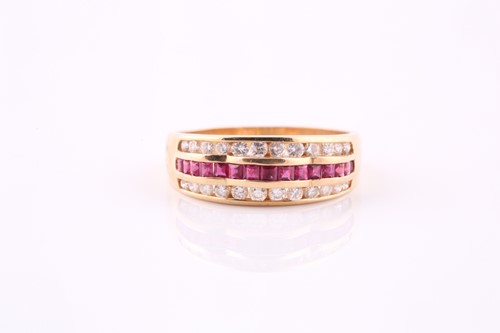 Lot 442 - A ruby and diamond half hoop ring, central...