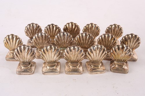 Lot 313 - A set of 16 sterling silver scallop shell form...