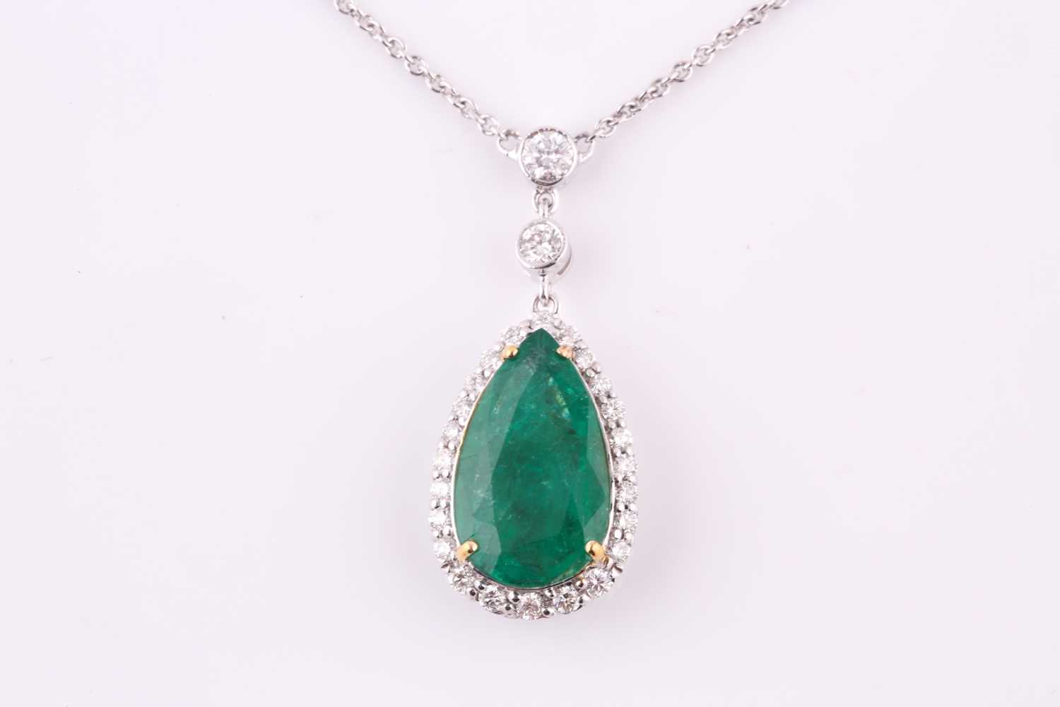 Lot 363 - An emerald and diamond pendant necklace, the...