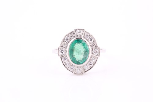 Lot 441 - An emerald and diamond cluster ring, the...
