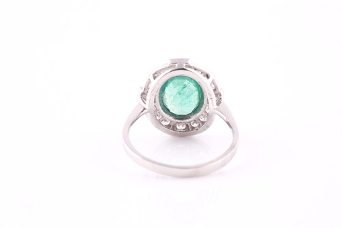 Lot 441 - An emerald and diamond cluster ring, the...