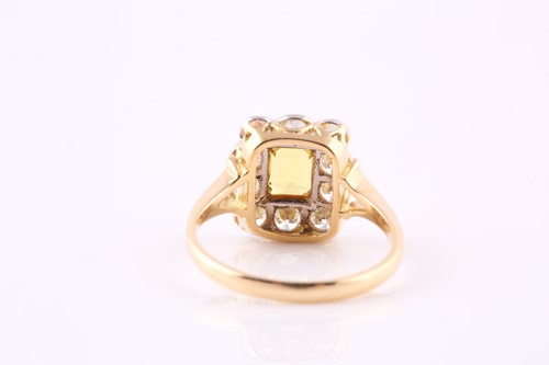 Lot 332 - A yellow sapphire and diamond cluster ring,...