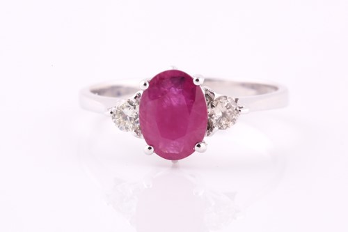 Lot 402 - A ruby and diamond ring, the 8 x 6mm...