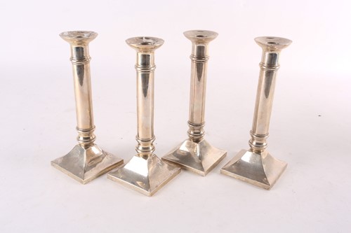 Lot 747 - A set of four sterling silver table...
