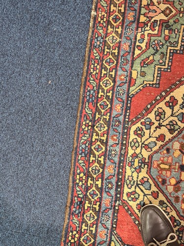 Lot 129 - A 20th-century red ground Turkish carpet...