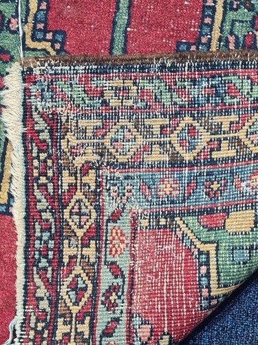 Lot 129 - A 20th-century red ground Turkish carpet...
