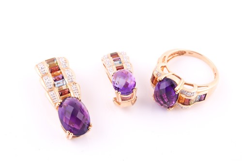 Lot 518 - An amethyst and multi-gem set dress ring, with...