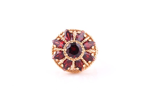 Lot 661 - A garnet cluster dress ring, set with round...