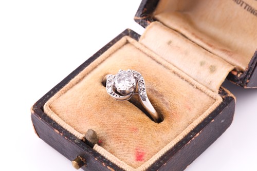 Lot 47 - An Edwardian diamond crossover ring, the eight...