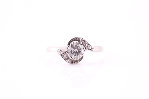 Lot 47 - An Edwardian diamond crossover ring, the eight...