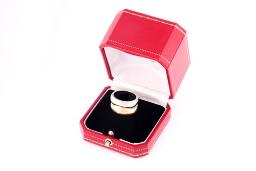 Lot 166 - A Cartier 'Love Me' set of two band rings, one...