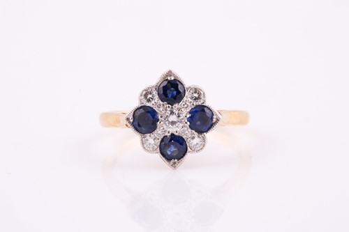 Lot 244 - A sapphire and diamond panel ring,the four...