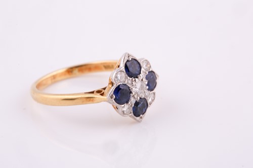 Lot 244 - A sapphire and diamond panel ring,the four...