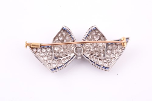 Lot 289 - An Art Deco sapphire and diamond bow brooch,...