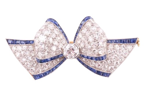 Lot 289 - An Art Deco sapphire and diamond bow brooch,...