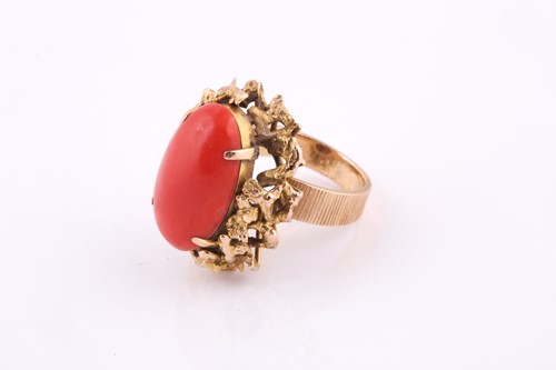 Lot 263 - A 1970’s Continental gold and coral cabochon...