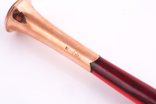 Lot 323 - A 9ct rose gold mounted cigarette holder,...
