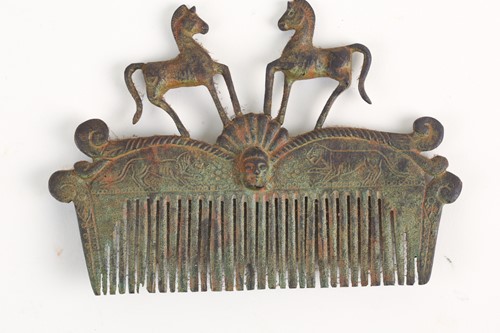 Lot 480 - A Roman-style verdigris bronze hair comb with...