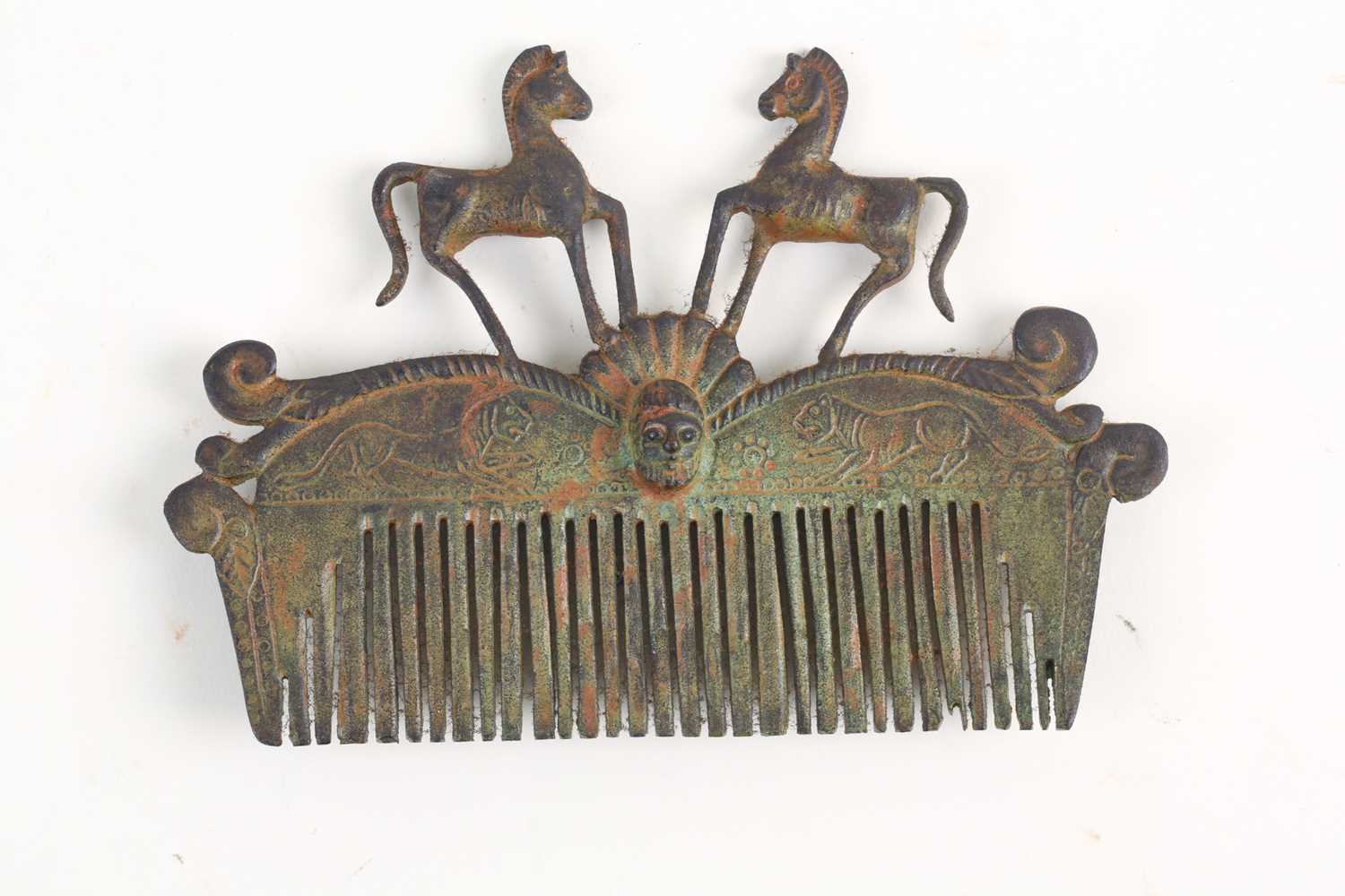Lot 480 - A Roman-style verdigris bronze hair comb