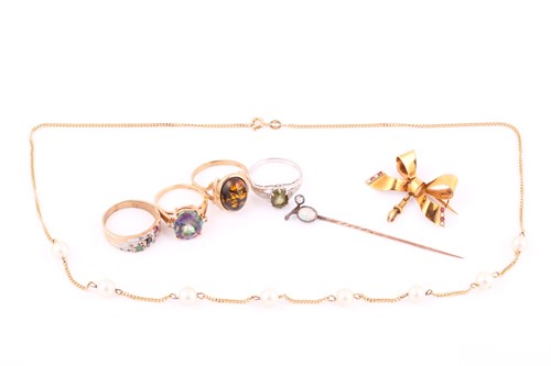 Lot 161 - A 9ct gold bow brooch set with seed pearls and...